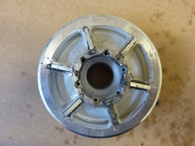 Central boss and 3mm webs added, the real webs are 15 mm thick so 3mm will be close enough.