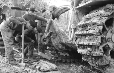 A brilliant busy photo of Track link replacement in the field , I have reproduced similar but no where near as good as the real thing.As I am applying zimmerit right now I was taking a look at this photo for reference, to me it has everything, bods, tools, tanks, it's black and white, there's mud and so a great patina for inspiration.