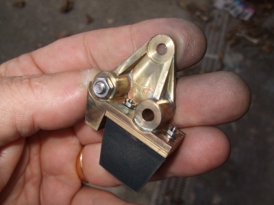 Brass bump stop with solid rubber