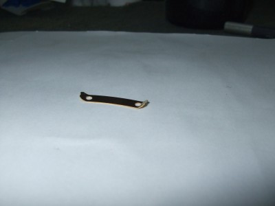 Bent brass tab