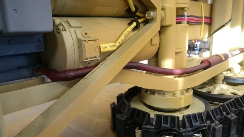 Theres just enough room between the motors and the front suspension &quot;A&quot; beam, although I have removed some material from the beams top edge just in case. The real exhaust pipe would sit just inside the chassis rail but there's two dirty great electric motors in the way.