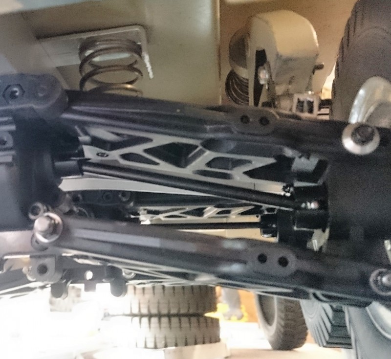 A small coil spring tucked away under the body allows for some fine adjustment of the ride height of each of the suspension assemblies