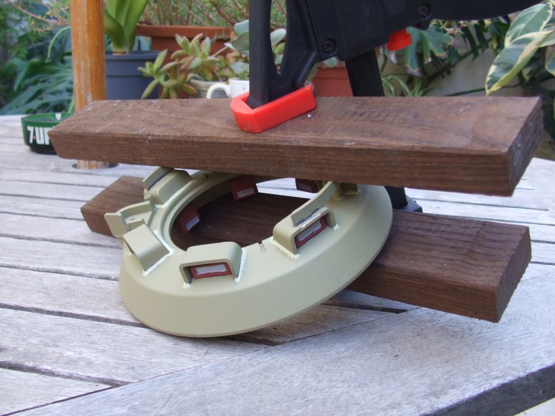 Clamped between two pieces of wood