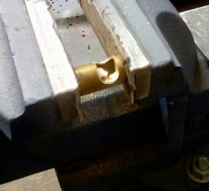 Use a round file to start the slot for the fender brace, then finish with a square, you can't really use a hack saw on thin brass tube or you risk bending it.