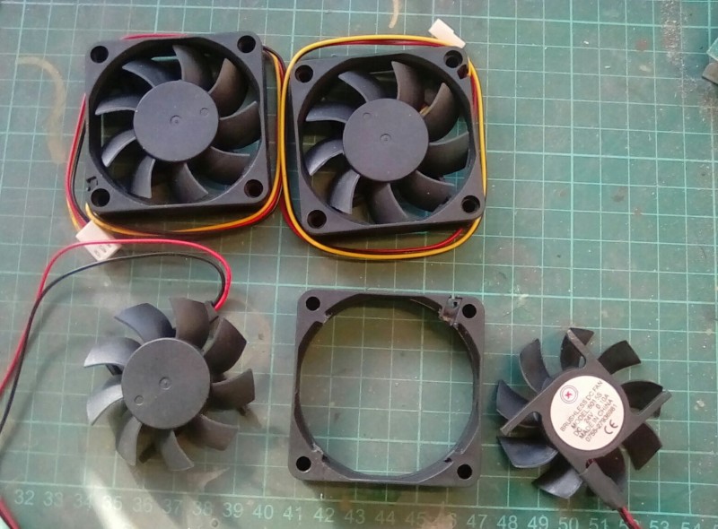 Demounting the radiator fans from their shrouds.