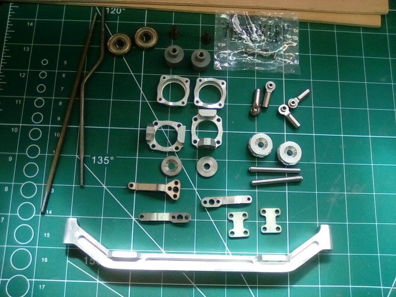The front axle all set out ready for deburring and assembly.