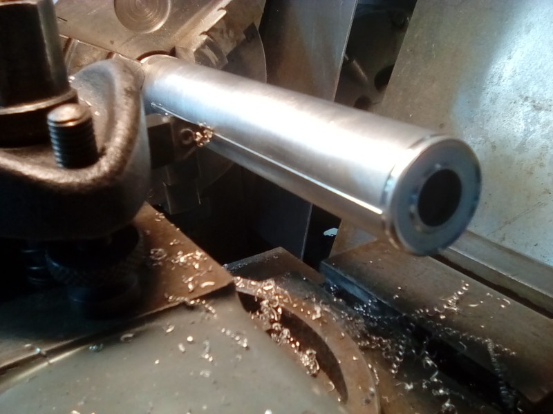 Creating the muffler seam using the lathe and lathe tool on its side.