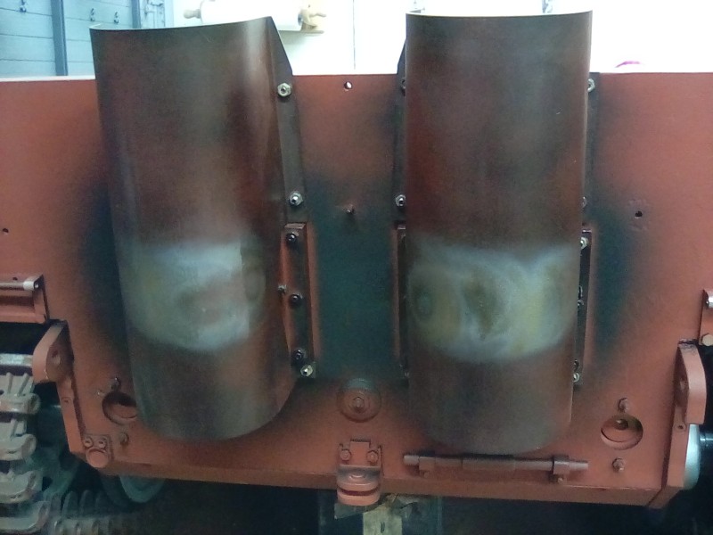 Weathering the heat shields with a blow torch.
