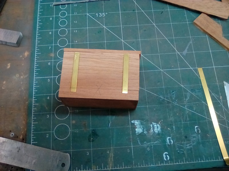 Fabricating the strap hinges for the medical box.