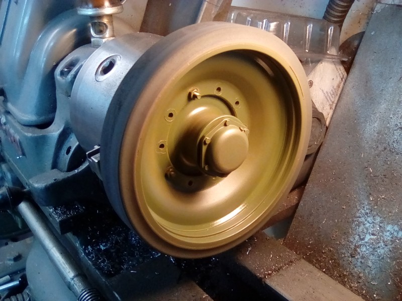 I find trimming back the paint overspray is easier on the lathe