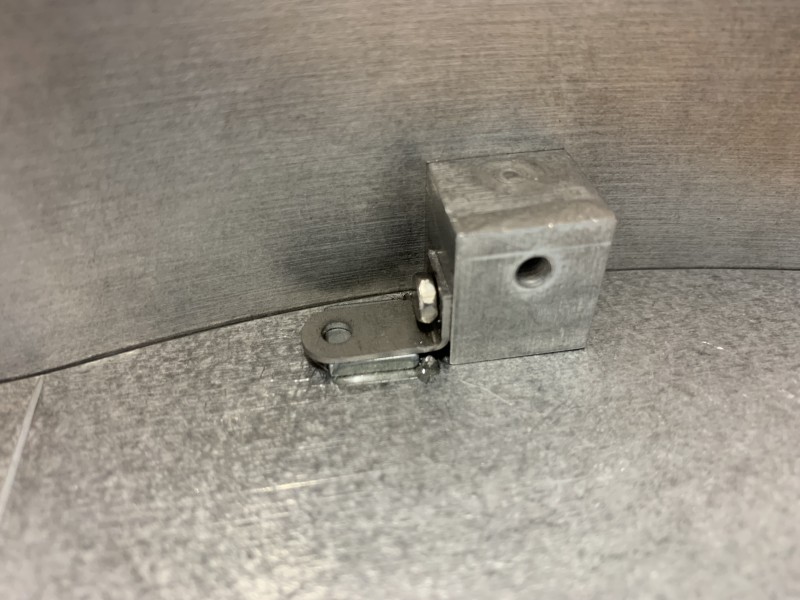 Neodynium magnet and steel bracket.