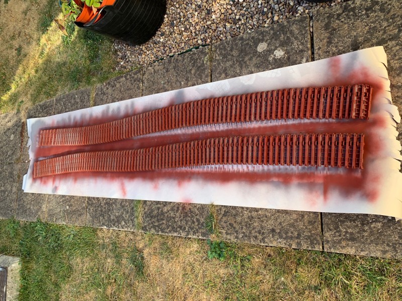 A splattering of red oxide, next the dark grey.