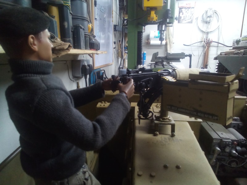 From what I have seen the ammo container holder was mounted at a slight angle and mounted level , I'm going for a slight angle