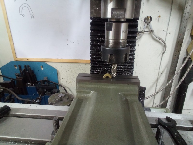 Milling the flats to take the tiny pivot axle pinch bolts.