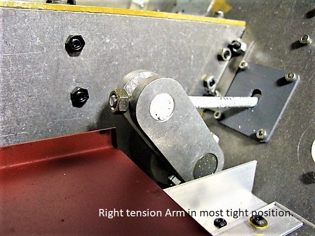 The right Tension Arm in most forward (ie, to tighten the right track) position.