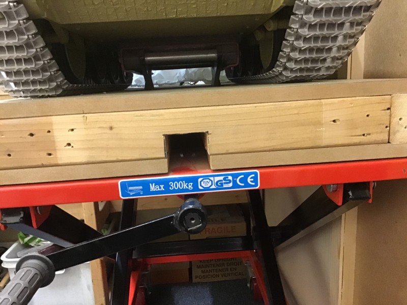 Motorcycle lift table raised to support the hull