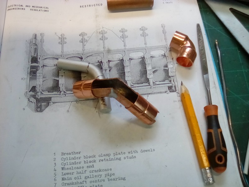 Using pipe couplers to support the section exhaust shield as I machine away the material