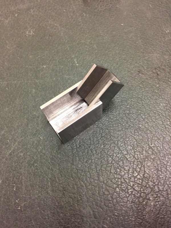 The top brackets were a little tricky. I didn't want flimsy bendy things, so this is what I came up with. Two bits of U channel machined to a nice fit.