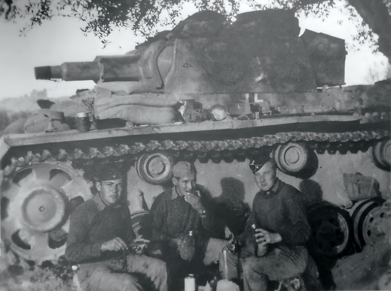 The regimental command tank and crew relaxing