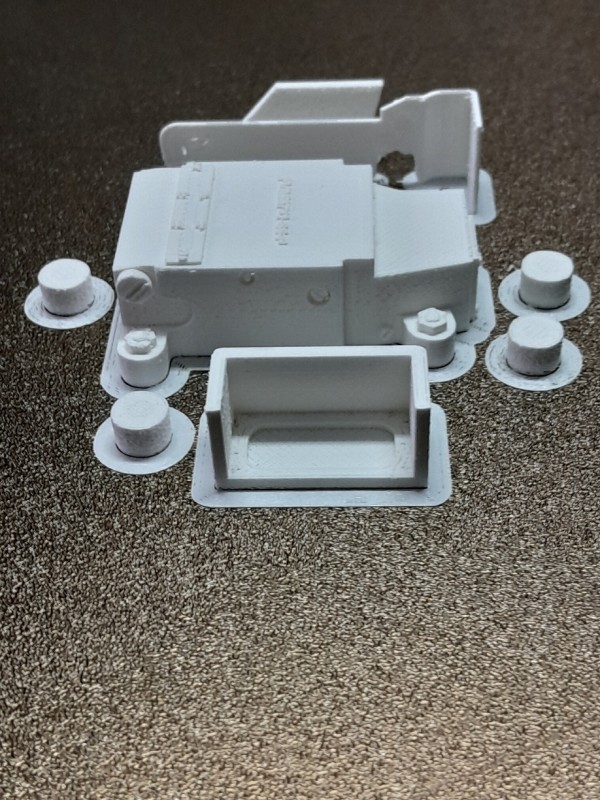 Parts on print bed.  The bottom part is the front part (hood) of the MRS which has to be glued on.