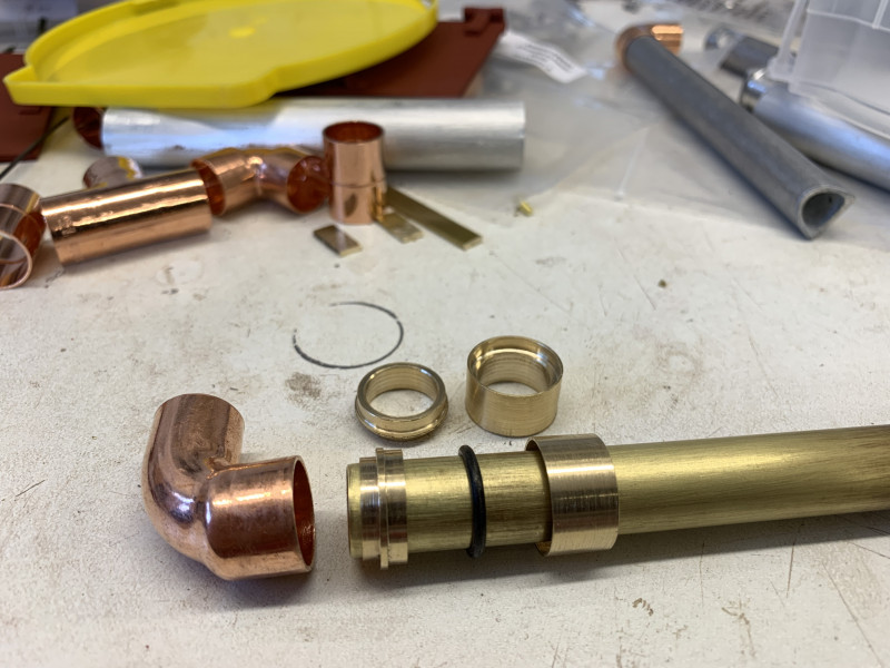 Two brass fittings with an O ring
