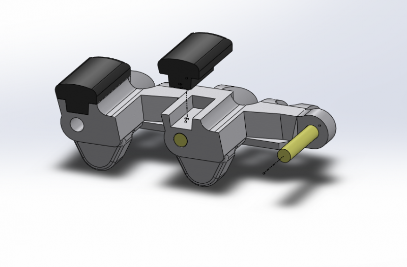 CROSS SECTION OF THE TRACK ASSEMBLY - RUBBER PADS SHOWN IN BLACK