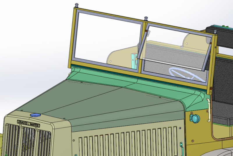 New design of windscreen - the drivers side window is now hinged. This has gone from being a 3 piece assembly to now being made from 16 parts.