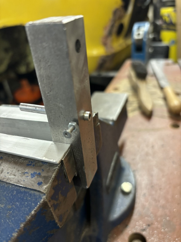 A little clamping screw to hold the tube in place.