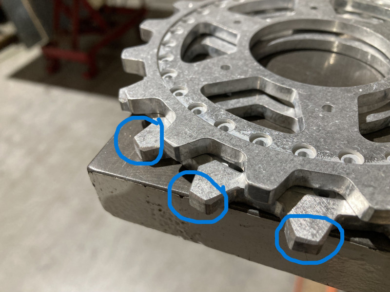 Sprocket ring chamfering. top one unmodified bottom one chamfered, helps with running in with tracks when new.